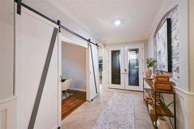 Prepare to be impressed by this STUNNING pool home on a on Links At Greenfield Plantation in Florida - for sale on GolfHomes.com, golf home, golf lot