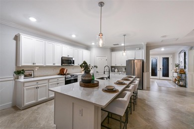 Prepare to be impressed by this STUNNING pool home on a on Links At Greenfield Plantation in Florida - for sale on GolfHomes.com, golf home, golf lot