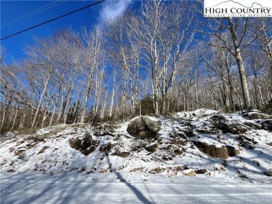 Uphill sloping lot in growing area close to Buckeye Recreation on Beech Mountain Club in North Carolina - for sale on GolfHomes.com, golf home, golf lot