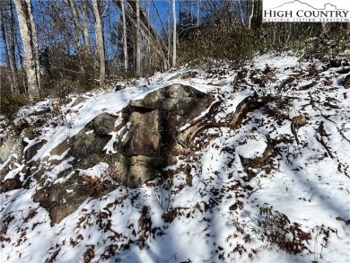 Uphill sloping lot in growing area close to Buckeye Recreation on Beech Mountain Club in North Carolina - for sale on GolfHomes.com, golf home, golf lot