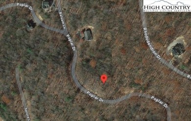 Uphill sloping lot in growing area close to Buckeye Recreation on Beech Mountain Club in North Carolina - for sale on GolfHomes.com, golf home, golf lot