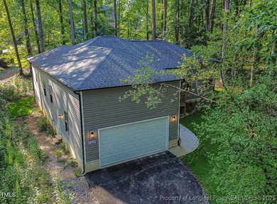 Come see this brand-new 3-bed, 2-bath custom home inside the on Carolina Trace Country Club in North Carolina - for sale on GolfHomes.com, golf home, golf lot