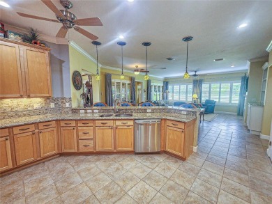 GOLF COURSE WITH GREAT VIEWS AND A STUNNING HOME LOCATED ON A on Eagle Ridge At Spruce Creek Country Club in Florida - for sale on GolfHomes.com, golf home, golf lot