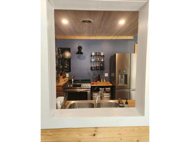 Rare ground-level 2 bed, 2 bath condo with carport and extra on Indian Hills Country Club in Arkansas - for sale on GolfHomes.com, golf home, golf lot