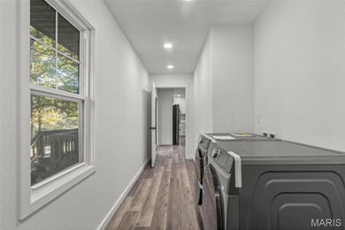 Completely renovated from top to bottom, this 4-bedroom, 3-bath on Terre Du Lac Golf and Country Club in Missouri - for sale on GolfHomes.com, golf home, golf lot