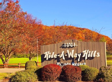 Welcome to your perfect cabin in the woods in Hide A-Way Hills! on Hide-A-Way Hills Golf Club in Ohio - for sale on GolfHomes.com, golf home, golf lot
