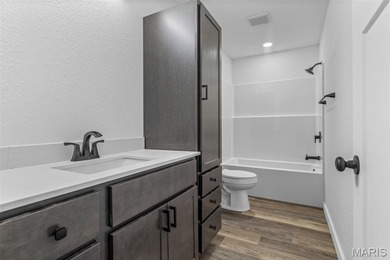 Completely renovated from top to bottom, this 4-bedroom, 3-bath on Terre Du Lac Golf and Country Club in Missouri - for sale on GolfHomes.com, golf home, golf lot
