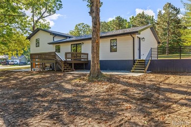 Completely renovated from top to bottom, this 4-bedroom, 3-bath on Terre Du Lac Golf and Country Club in Missouri - for sale on GolfHomes.com, golf home, golf lot