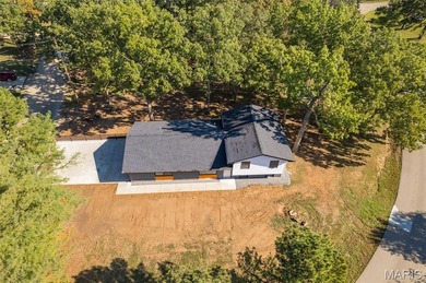 Completely renovated from top to bottom, this 4-bedroom, 3-bath on Terre Du Lac Golf and Country Club in Missouri - for sale on GolfHomes.com, golf home, golf lot