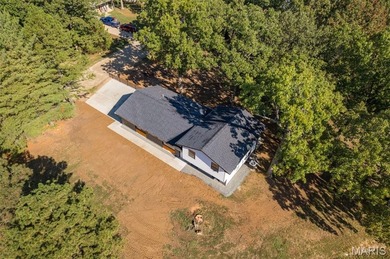 Completely renovated from top to bottom, this 4-bedroom, 3-bath on Terre Du Lac Golf and Country Club in Missouri - for sale on GolfHomes.com, golf home, golf lot