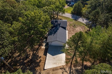 Completely renovated from top to bottom, this 4-bedroom, 3-bath on Terre Du Lac Golf and Country Club in Missouri - for sale on GolfHomes.com, golf home, golf lot
