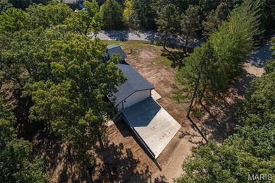 Completely renovated from top to bottom, this 4-bedroom, 3-bath on Terre Du Lac Golf and Country Club in Missouri - for sale on GolfHomes.com, golf home, golf lot