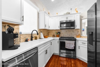 Check Out this Attached Villa with Extra Large Yard in the on Silverthorn Country Club in Florida - for sale on GolfHomes.com, golf home, golf lot