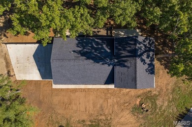 Completely renovated from top to bottom, this 4-bedroom, 3-bath on Terre Du Lac Golf and Country Club in Missouri - for sale on GolfHomes.com, golf home, golf lot