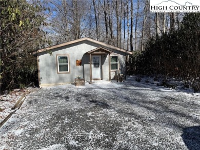 This charming two-bedroom, one-and-a-half-bath cottage features on Land Harbor Golf Course in North Carolina - for sale on GolfHomes.com, golf home, golf lot