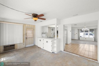 Beautiful 2 bed, 1 bath, garage corner lot with pleasant, quaint on Woodlands Country Club in Florida - for sale on GolfHomes.com, golf home, golf lot
