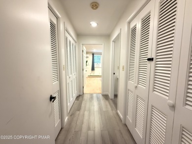 Nestled on a wooded lot backing up to the golf course, this on Pocono Farms Country Club in Pennsylvania - for sale on GolfHomes.com, golf home, golf lot