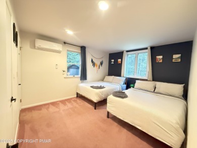 Nestled on a wooded lot backing up to the golf course, this on Pocono Farms Country Club in Pennsylvania - for sale on GolfHomes.com, golf home, golf lot