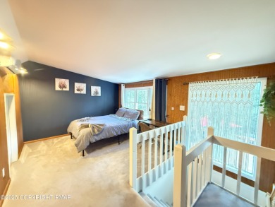 Nestled on a wooded lot backing up to the golf course, this on Pocono Farms Country Club in Pennsylvania - for sale on GolfHomes.com, golf home, golf lot