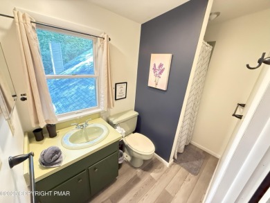 Nestled on a wooded lot backing up to the golf course, this on Pocono Farms Country Club in Pennsylvania - for sale on GolfHomes.com, golf home, golf lot