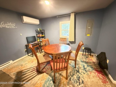 Nestled on a wooded lot backing up to the golf course, this on Pocono Farms Country Club in Pennsylvania - for sale on GolfHomes.com, golf home, golf lot