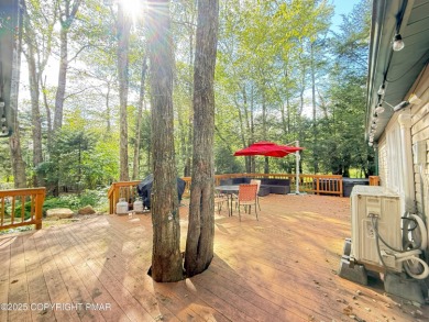Nestled on a wooded lot backing up to the golf course, this on Pocono Farms Country Club in Pennsylvania - for sale on GolfHomes.com, golf home, golf lot