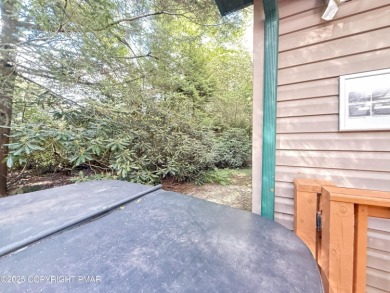 Nestled on a wooded lot backing up to the golf course, this on Pocono Farms Country Club in Pennsylvania - for sale on GolfHomes.com, golf home, golf lot
