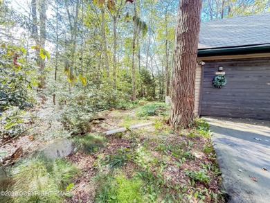 Nestled on a wooded lot backing up to the golf course, this on Pocono Farms Country Club in Pennsylvania - for sale on GolfHomes.com, golf home, golf lot