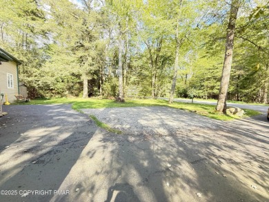 Nestled on a wooded lot backing up to the golf course, this on Pocono Farms Country Club in Pennsylvania - for sale on GolfHomes.com, golf home, golf lot