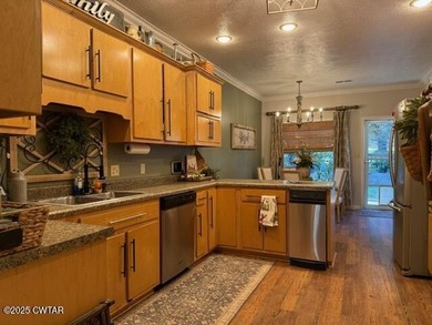 Wonderful 4BR 3BA, 2 car garage, fenced back yard with pergola on Dyersburg Country Club At The Farms in Tennessee - for sale on GolfHomes.com, golf home, golf lot