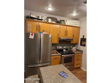 Wonderful 4BR 3BA, 2 car garage, fenced back yard with pergola on Dyersburg Country Club At The Farms in Tennessee - for sale on GolfHomes.com, golf home, golf lot