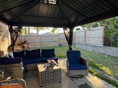 Wonderful 4BR 3BA, 2 car garage, fenced back yard with pergola on Dyersburg Country Club At The Farms in Tennessee - for sale on GolfHomes.com, golf home, golf lot