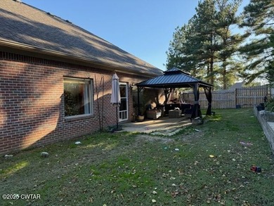 Wonderful 4BR 3BA, 2 car garage, fenced back yard with pergola on Dyersburg Country Club At The Farms in Tennessee - for sale on GolfHomes.com, golf home, golf lot