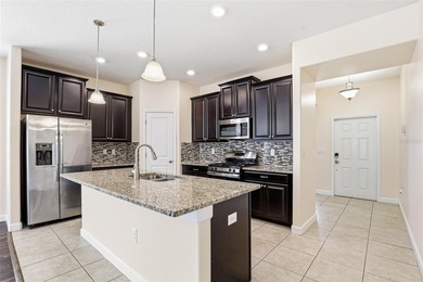 Images have been virtually staged for illustrative purposes on The Groves Golf and Country Club in Florida - for sale on GolfHomes.com, golf home, golf lot