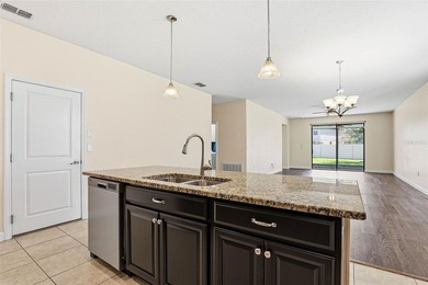 Images have been virtually staged for illustrative purposes on The Groves Golf and Country Club in Florida - for sale on GolfHomes.com, golf home, golf lot