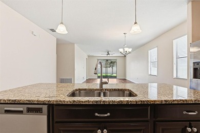 Images have been virtually staged for illustrative purposes on The Groves Golf and Country Club in Florida - for sale on GolfHomes.com, golf home, golf lot