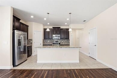 Images have been virtually staged for illustrative purposes on The Groves Golf and Country Club in Florida - for sale on GolfHomes.com, golf home, golf lot