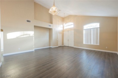 Experience refined living in this elegant 4-bedroom, 3-bath on Rhodes Ranch Golf Club in Nevada - for sale on GolfHomes.com, golf home, golf lot