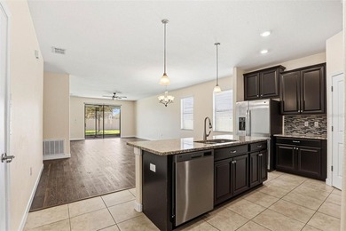 Images have been virtually staged for illustrative purposes on The Groves Golf and Country Club in Florida - for sale on GolfHomes.com, golf home, golf lot