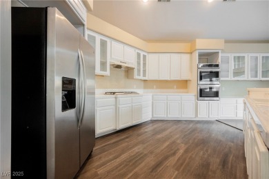Experience refined living in this elegant 4-bedroom, 3-bath on Rhodes Ranch Golf Club in Nevada - for sale on GolfHomes.com, golf home, golf lot