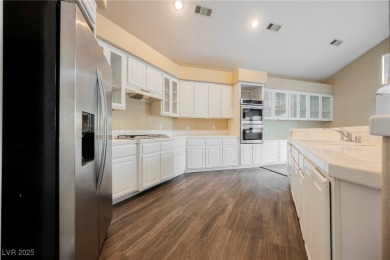 Experience refined living in this elegant 4-bedroom, 3-bath on Rhodes Ranch Golf Club in Nevada - for sale on GolfHomes.com, golf home, golf lot
