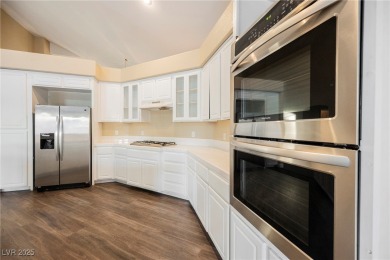 Experience refined living in this elegant 4-bedroom, 3-bath on Rhodes Ranch Golf Club in Nevada - for sale on GolfHomes.com, golf home, golf lot
