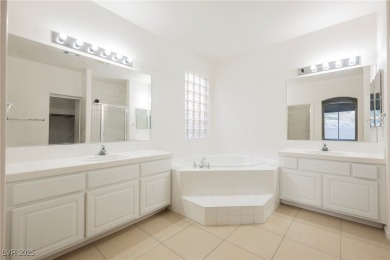 Experience refined living in this elegant 4-bedroom, 3-bath on Rhodes Ranch Golf Club in Nevada - for sale on GolfHomes.com, golf home, golf lot