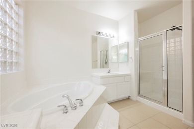 Experience refined living in this elegant 4-bedroom, 3-bath on Rhodes Ranch Golf Club in Nevada - for sale on GolfHomes.com, golf home, golf lot