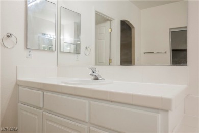 Experience refined living in this elegant 4-bedroom, 3-bath on Rhodes Ranch Golf Club in Nevada - for sale on GolfHomes.com, golf home, golf lot