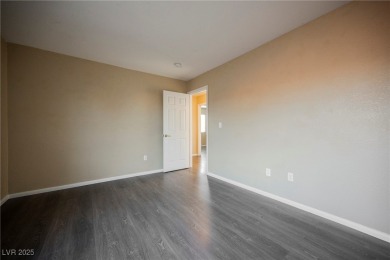 Experience refined living in this elegant 4-bedroom, 3-bath on Rhodes Ranch Golf Club in Nevada - for sale on GolfHomes.com, golf home, golf lot