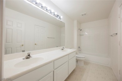 Experience refined living in this elegant 4-bedroom, 3-bath on Rhodes Ranch Golf Club in Nevada - for sale on GolfHomes.com, golf home, golf lot