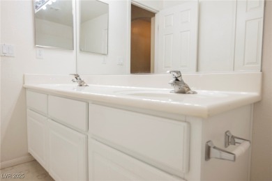 Experience refined living in this elegant 4-bedroom, 3-bath on Rhodes Ranch Golf Club in Nevada - for sale on GolfHomes.com, golf home, golf lot