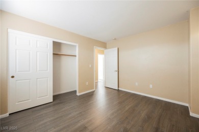Experience refined living in this elegant 4-bedroom, 3-bath on Rhodes Ranch Golf Club in Nevada - for sale on GolfHomes.com, golf home, golf lot