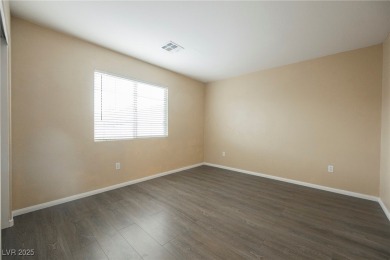 Experience refined living in this elegant 4-bedroom, 3-bath on Rhodes Ranch Golf Club in Nevada - for sale on GolfHomes.com, golf home, golf lot